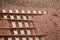 High angle closeup shot of graded stones on the rails of a train