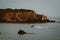 High-angle of a gloomy seascape view with rocky cliffs and sky background