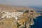 High-angle of Lindos village on a sunlit rocky island with a seascape view, Rhodes, Greece