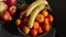 High angle, mandarin oranges, bananas, apples, fresh fruit in bowls on balcony,