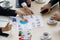 High angle of meeting table with colorful graph and chart and white coffee cup on meeting table