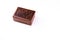 High angle mid close up of a brown wooden box on white background. Ayurvedic medicines concept