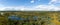 High angle panorama view of lakes and lagoons in a raised bog and marsh landscape