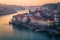 High-angle of Porto cityscape at sunset, purple and golden sky background