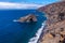 High angle shot of a beach surrounded with cliffs in the Canary Islands