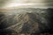 High angle shot of the beautiful mountain peaks under the dull cloudy sky captured in Italy