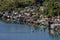 High angle shot of boats on the water near buildings on the shore