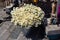 High angle shot of a bouquet of daisy flowers on a bucket in the shop