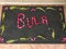 High angle shot of "BULA" text spelled out in flowers in a front door mat in Fiji