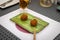 High-angle shot of cheese falafels on a green plate served at a local Japanese restaurant