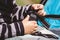 High angle shot of a child fixing his blue car seat captured on a sunny day