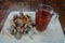 High angle shot of a cup of tea and some ginger on a wooden surface on a table