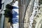 High angle shot of an empty railway with multiple rails surrounded by hills covered with snow