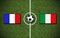 High angle shot of the flags of France and Italy with a soccer ball in the center on a soccer field