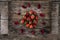 High angle shot of fresh strawberries and red flower petals on a wooden surface