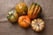 High angle shot of a group of autumn gourds, squash and pumpkins on burlap