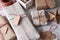 High angle shot of a group of fabric and paper wrapped presents.