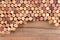 High angle shot of a group of wine corks on wood table with copy space