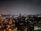 High angle shot of a hazy city with colorful lights at night