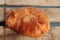 High angle shot of a loaf of homemade bread on a wooden surface