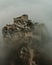 High-angle shot of the majestic Srebrenik fortress covered with mist