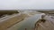 High angle shot of a muddy river by the fields in Blakeney, Norfolk, UK