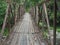 High angle shot of an old metal footbridge in the forest