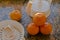 High angle shot of oranges prepared for juicing on a kitchen counter