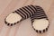 High angle shot of a pair of striped warm slippers