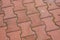 High angle shot of a patterned red cobblestone ground