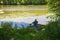 High angle shot of a person coarse fishing at a lake in Wiltshire, UK in the early morning