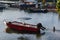 High angle shot of a red skiff boat in the sea