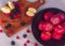 High angle shot of ripe red apples with raspberries and blackberries on the table