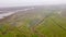 High angle shot of a river by the farms in Blakeney, Norfolk, UK