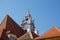 High angle shot of the roof of a historic Christian church with a beautiful blue tower