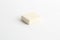 High angle shot of a small white eraser isolated on a white surface