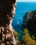 High-angle shot of a speedboat cruising in between the islands of Capri in the Gulf of Naples, Italy