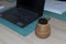 High angle shot of yerba mate beside laptop on a table