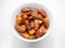 High Angle, stack of dates palm(Phoenix dactylifera) in white bowl, white background