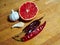 High angle still life view of kitchen wooden cutting board with garlic, chilli and grapefruit