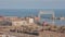 A High Angle Timelapse Shot of Boat Traffic and the Iconic Duluth Aerial Lift Bridge during a Clear Fall Day