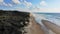 High angle view of 4WD driving throw the infinite beach in Fraser Island