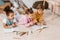 high angle view of adorable multiethnic children lying on carpet and