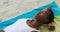 High angle view of African american woman sleeping on the beach 4k