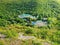 High angle view from altitude to the Saharna Monastery, Moldova. Idyllic place with the church in the middle of woods on the gorge