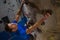 High angle view of athlete climbing wall in fitness studio