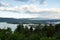 High angle view of Baie-Saint-Paul valley under low fog and the St. Lawrence River seen from point of view