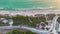 High angle view of Blind Pass beach on Manasota Key in Englewood, USA. People enjoying vacations time swimming in ocean