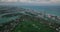 High angle view of buildings at sea coast. Aerial shot of residential borough and row of tall apartment buildings at