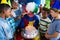 High angle view of children with clown standing by cake